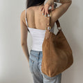 Y2K slouchy brown suede hobo bag by Le Chateau